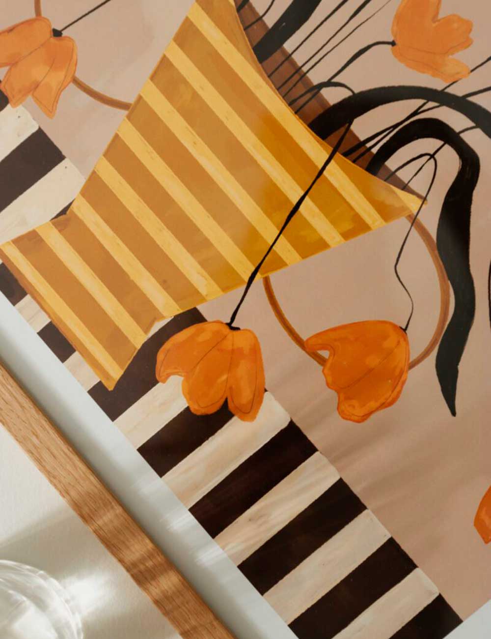 Flowers in yellow striped vase