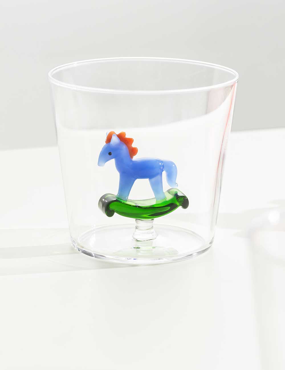 Rocking horse tumbler