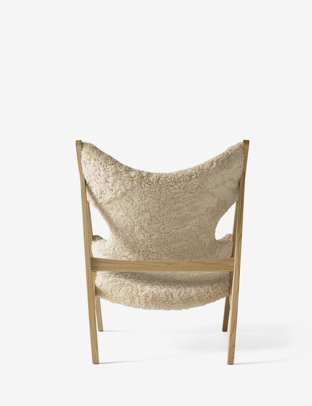 chaise longue tricotée en peau de mouton