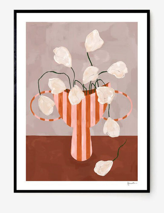 white flowers in striped vase