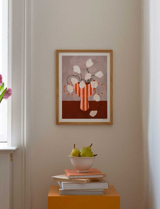 white flowers in striped vase
