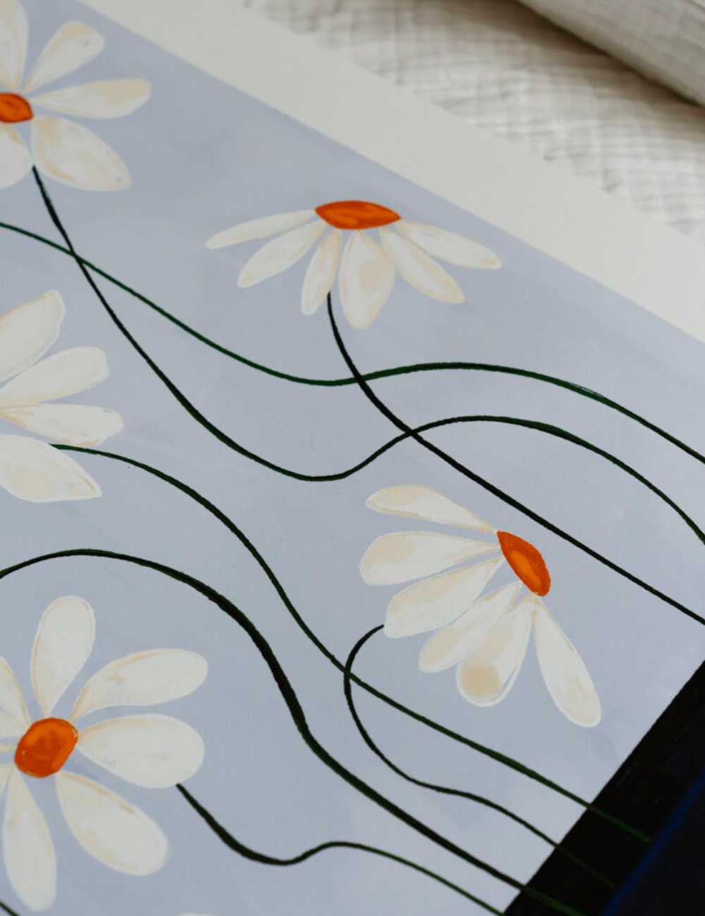 Daisies in blue vase