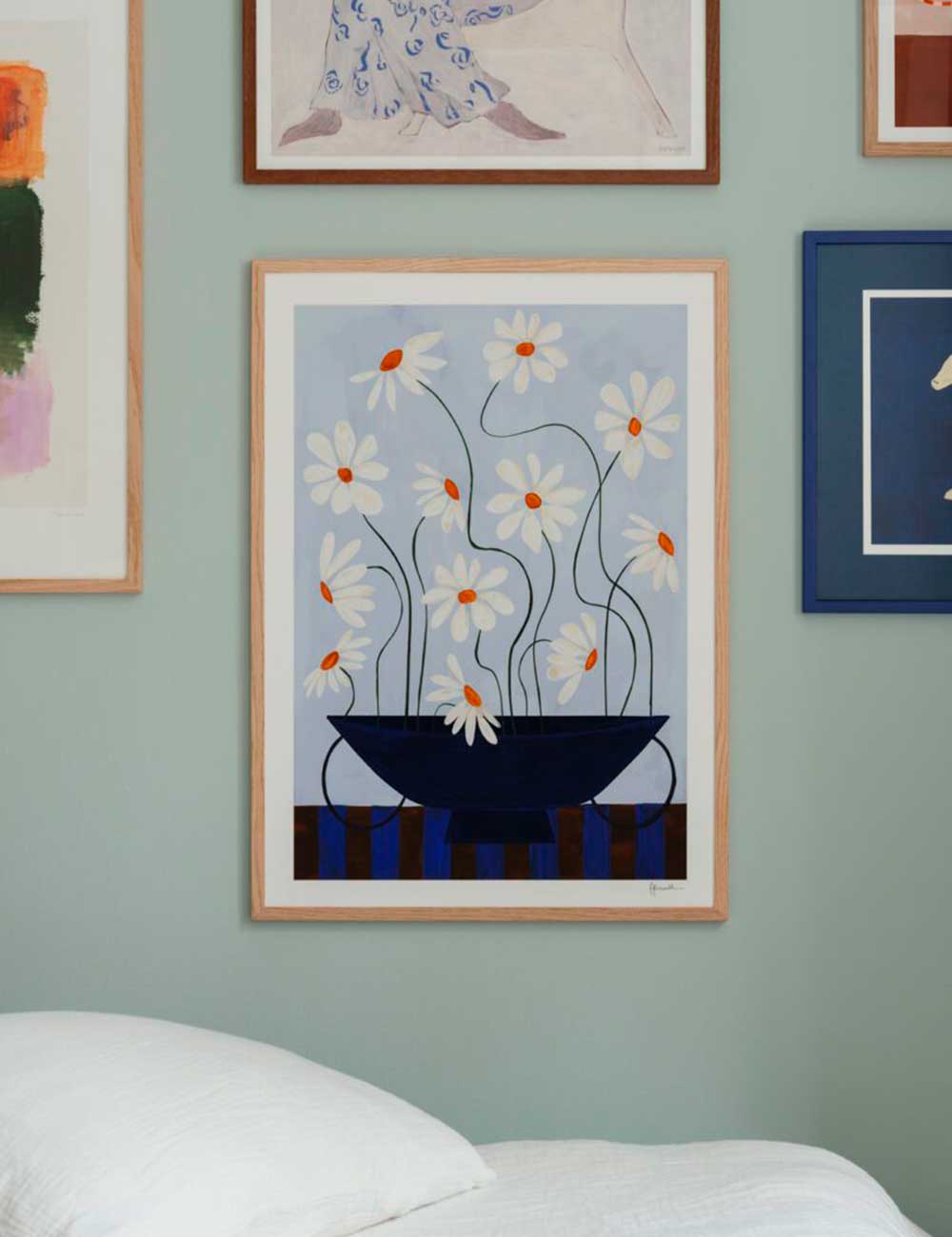 Daisies in blue vase